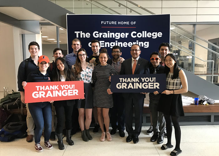 The Dean with Students Holding "Thank You" Sign