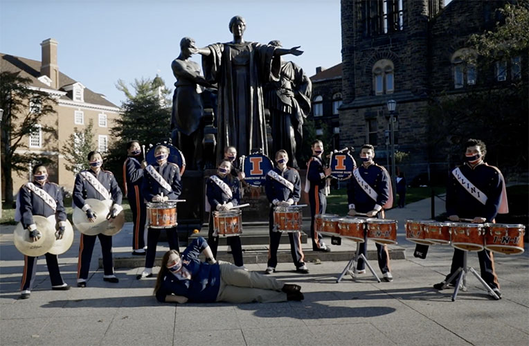 Marching Illini Playing Instruments In Front of Alma