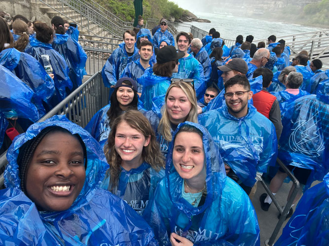 Students in rain jackets
