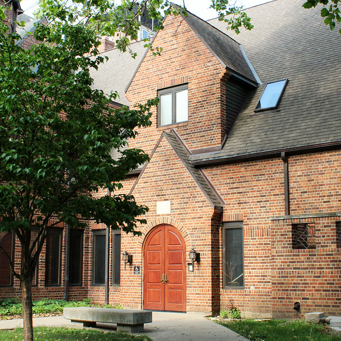 exterior brick building with red door